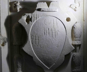 Lower cartouche on the chancel monument