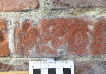 Brick in south porch with 1780 graffito