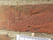 Runes to west of the doorway